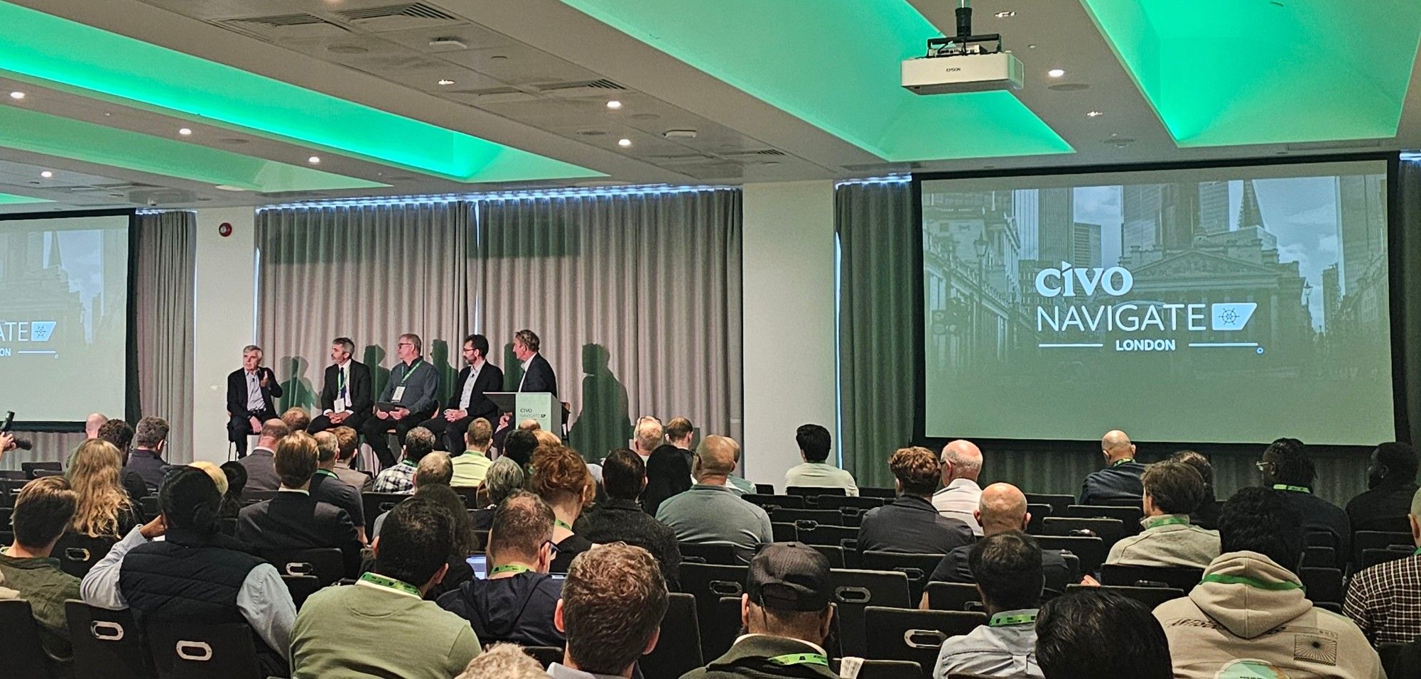 A panel on the main stage at Civo Navigate London in front of a full audience